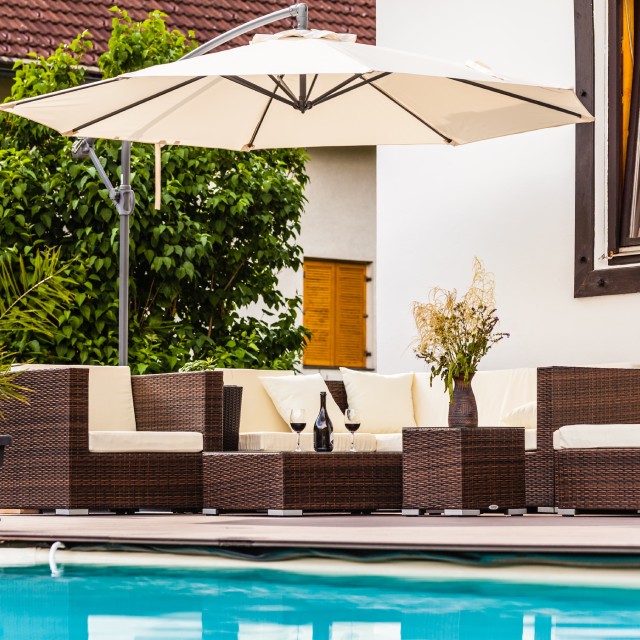 Wicker patio furniture with large umbrella
